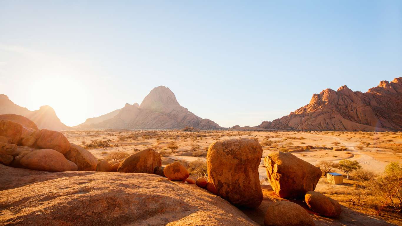 brown rocky mountain under blue sky during daytime